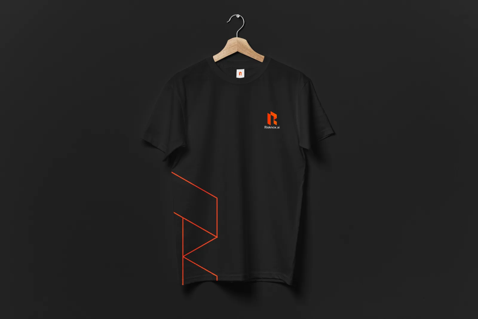 A black Risknox.ai branded t-shirt on a hanger